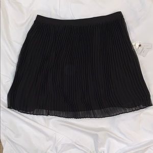 Black, pleated miniskirt